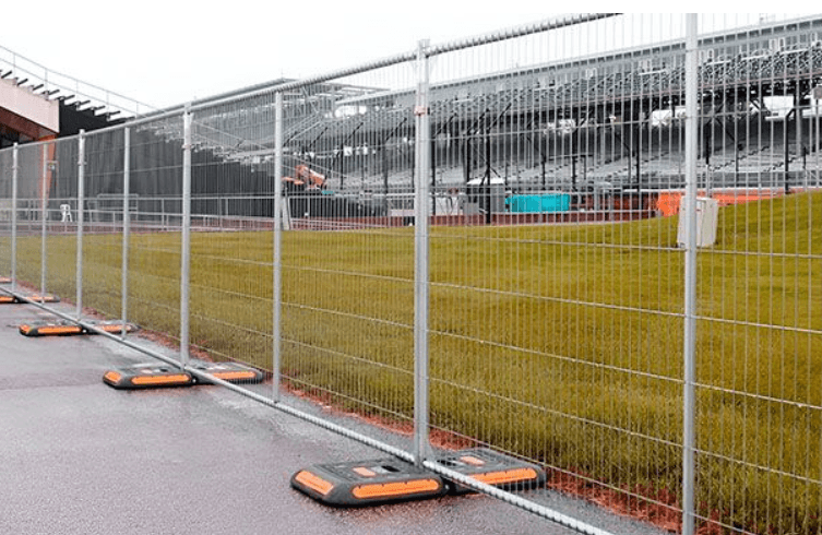 Welded-wire temporary fence panels on a job site